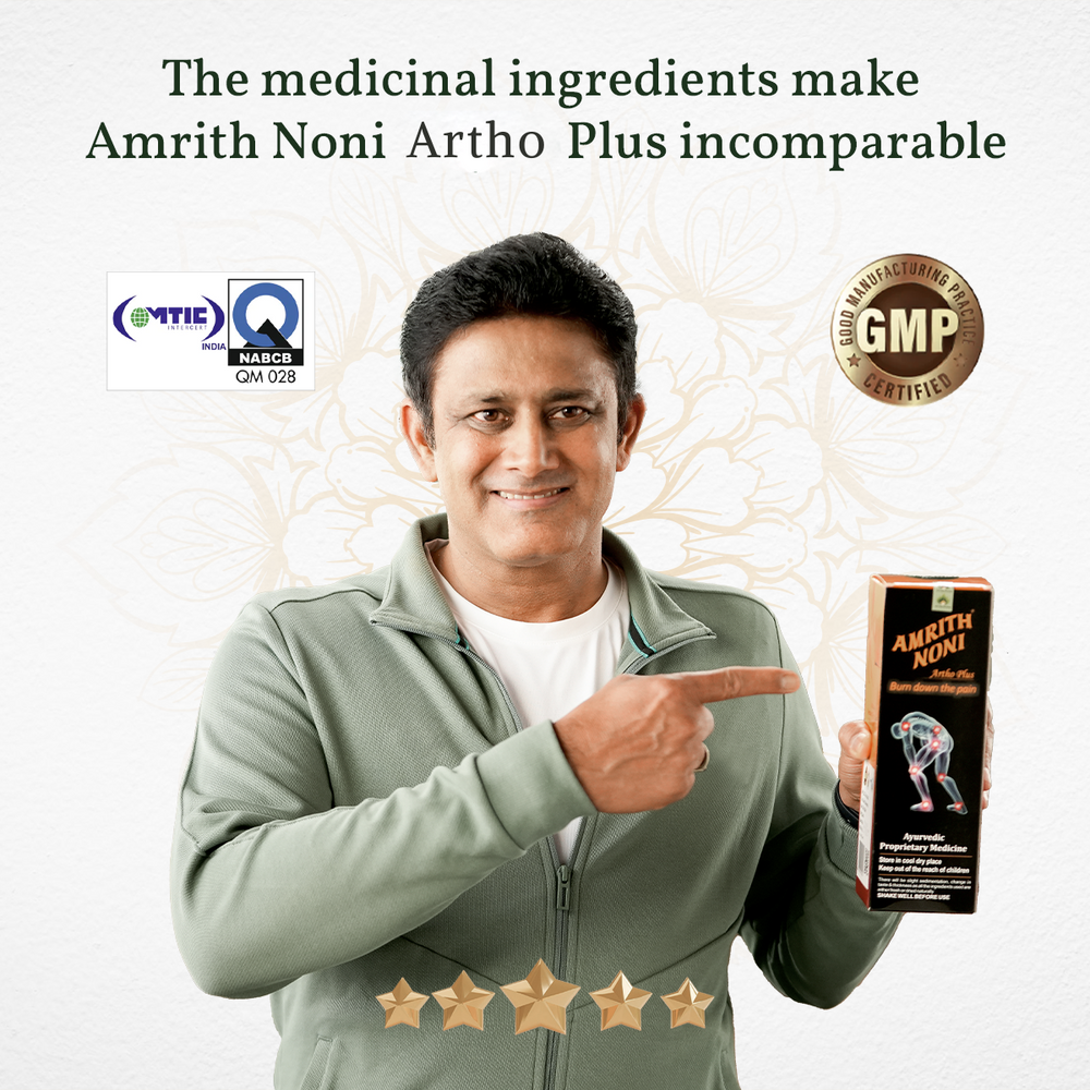 
                  
                    Anil Kumble pointing towards Amrith Noni Artho Plus product box with certification logos on a plain white background
                  
                